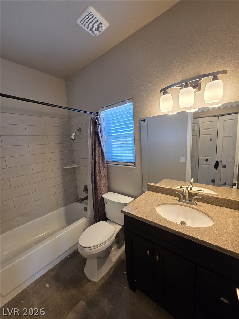 2275 Ramsgate Drive Henderson, NV 89074 - Photo 67 of 84 A well-appointed bath features a sleek vanity and tiled tub surround.