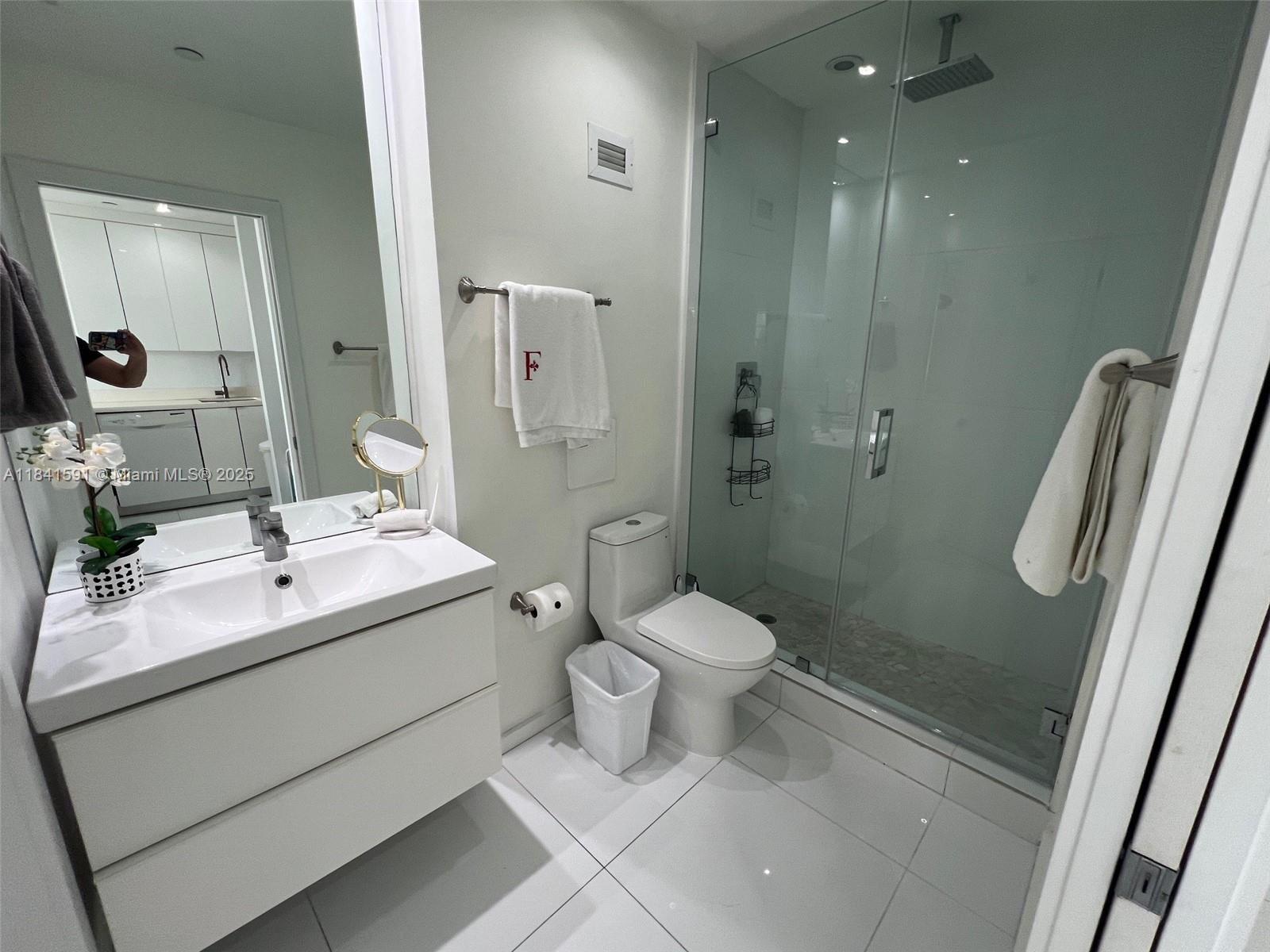 100 Lincoln Road, Unit 1601 Miami Beach, FL 33139 - Photo 17 of 57 a bathroom with a sink toilet and shower