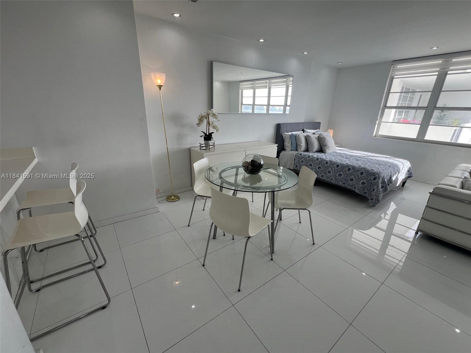 100 Lincoln Road, Unit 1601 Miami Beach, FL 33139 - Photo 9 of 57 a living room with furniture and a window