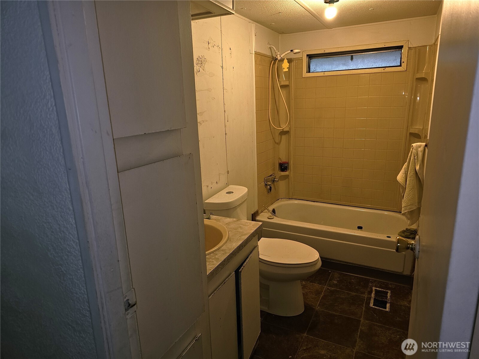 5128 335th Lane Southeast Fall City, WA 98024 - Photo 29 of 36 a bathroom with a granite countertop toilet a sink and a shower