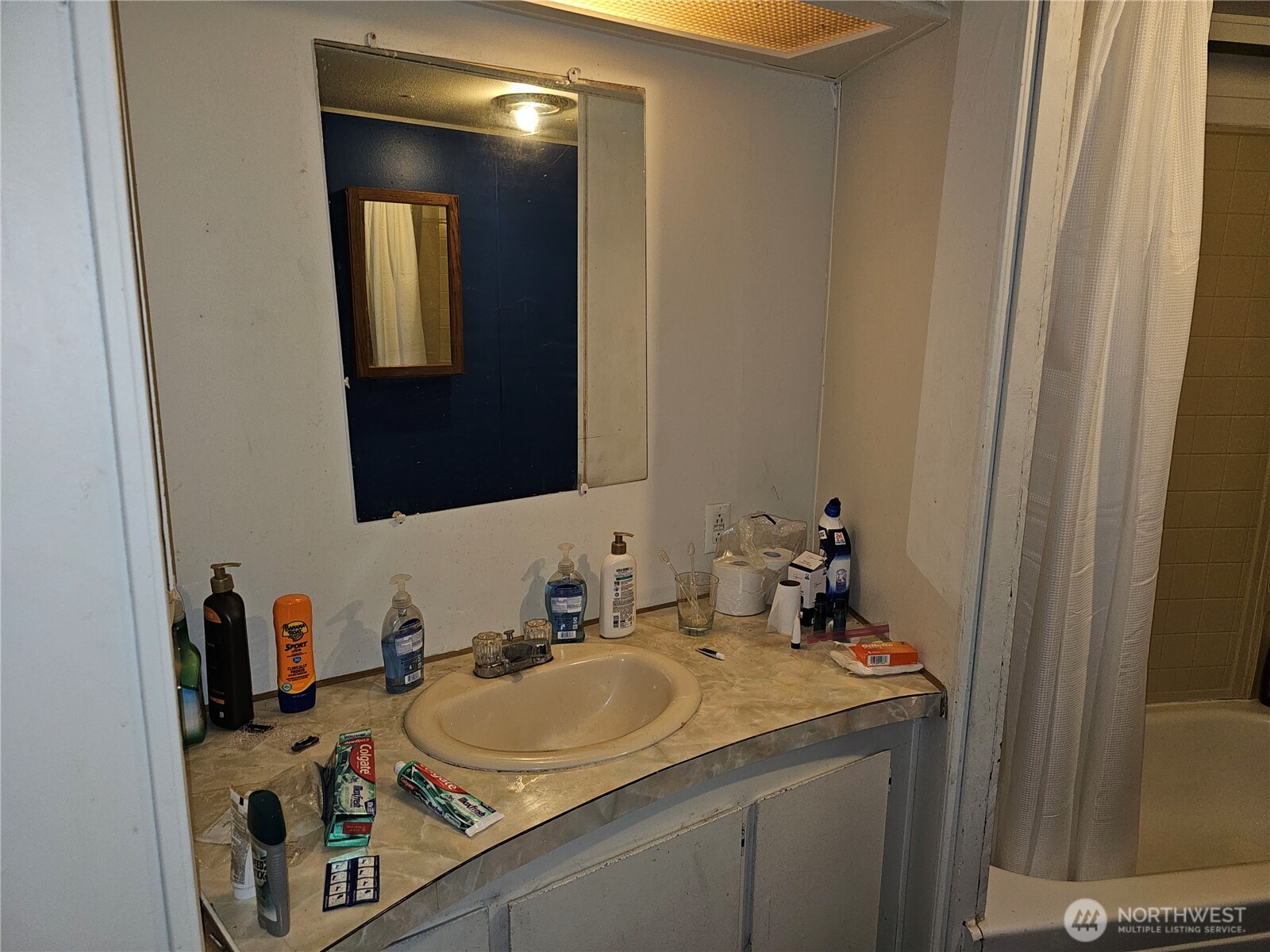 5128 335th Lane Southeast Fall City, WA 98024 - Photo 32 of 36 a bathroom with a sink and a mirror