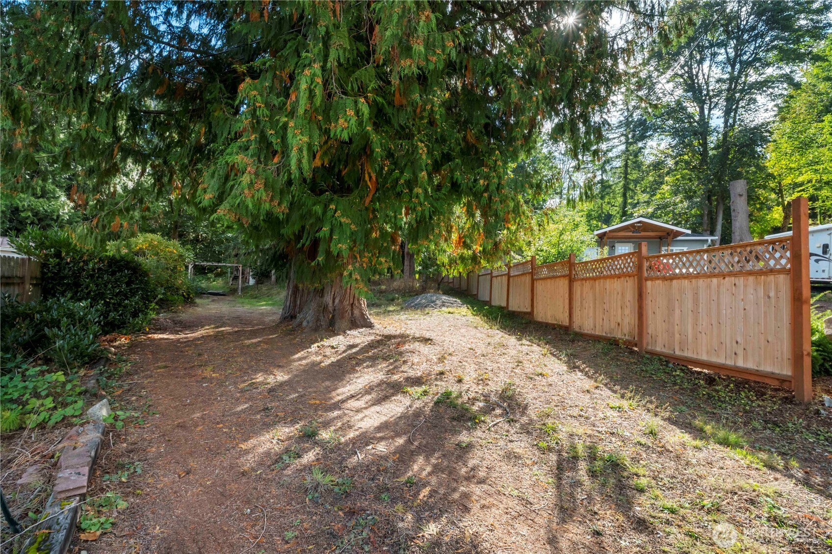 5128 335th Lane Southeast Fall City, WA 98024 - Photo 7 of 36 a view of backyard with green space and wooden fence