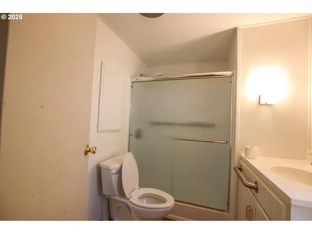 a bathroom with a shower and a toilet