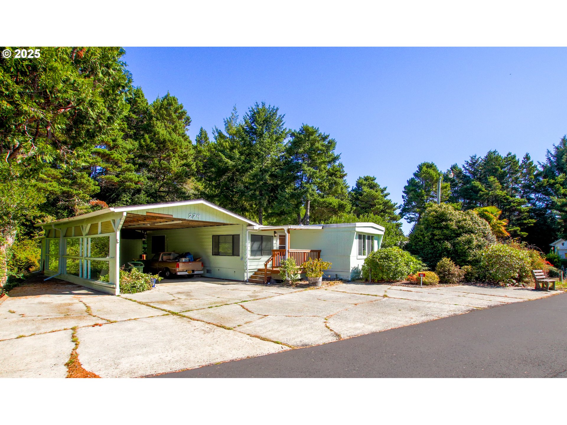 1600 Rhododendron Drive, Unit 279 Florence, OR 97439 - Photo 2 of 30 a view of a house with backyard porch and sitting area