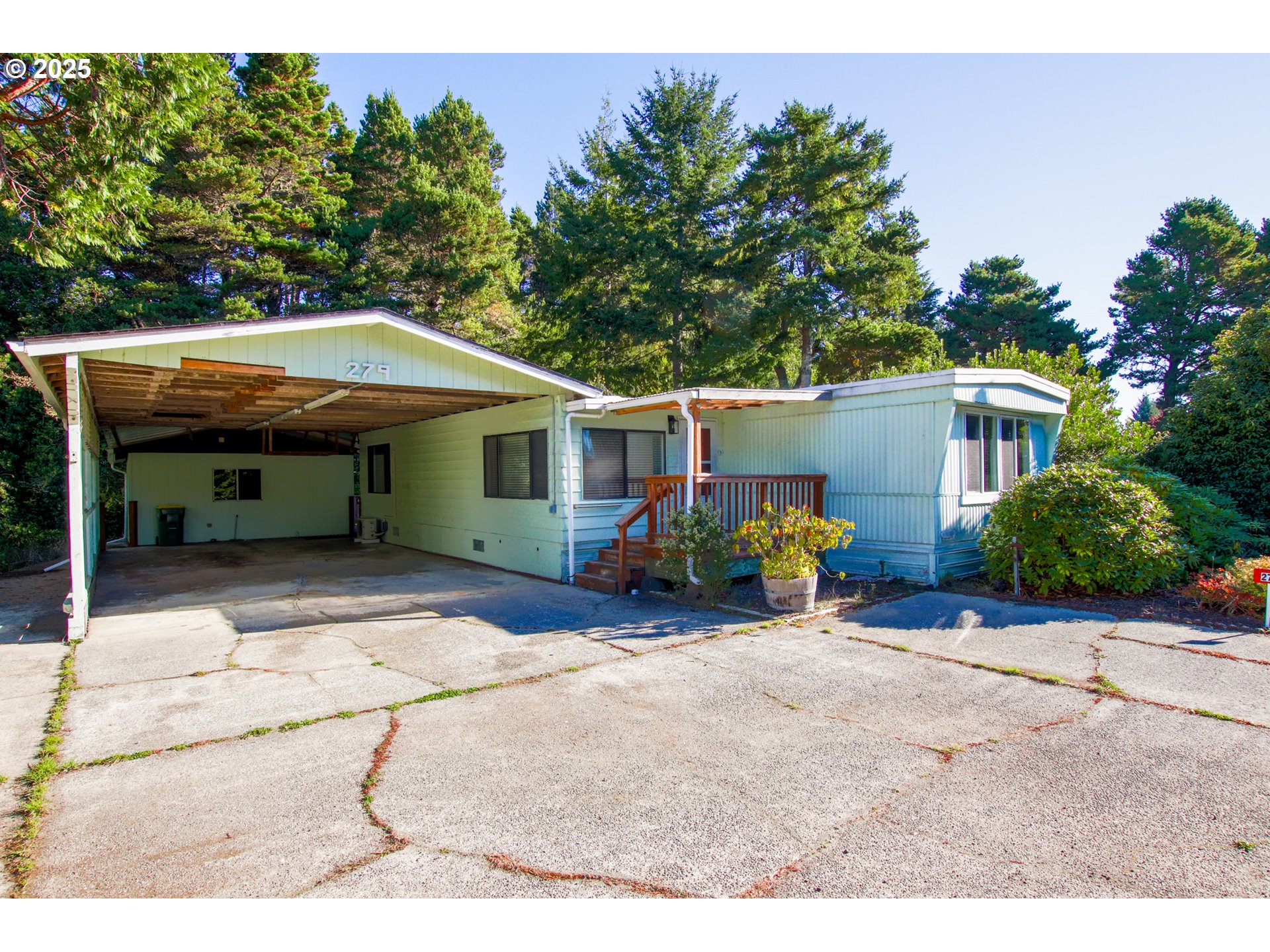 1600 Rhododendron Drive, Unit 279 Florence, OR 97439 - Photo 27 of 30 a view of a house with backyard and sitting area