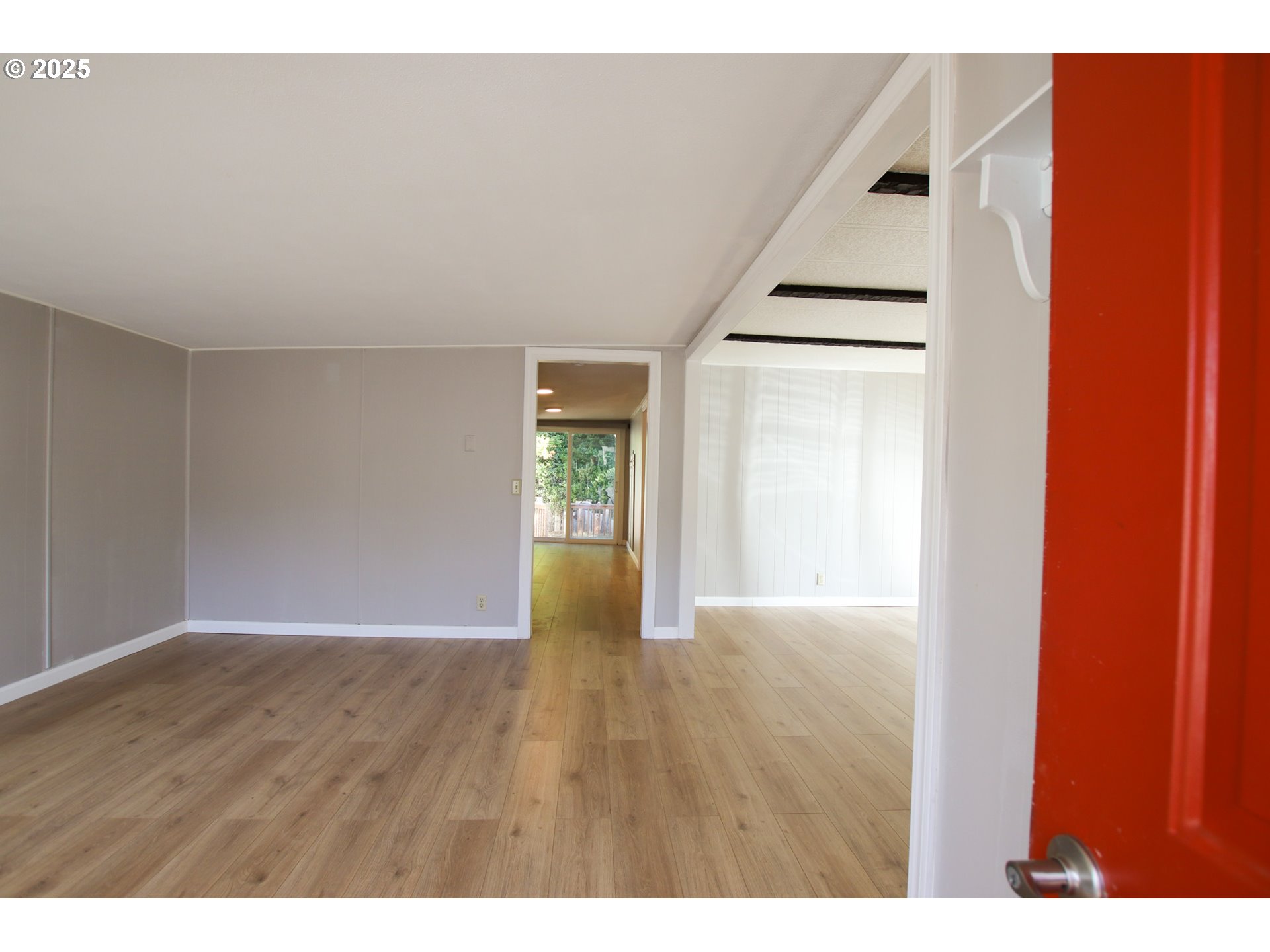 1600 Rhododendron Drive, Unit 279 Florence, OR 97439 - Photo 5 of 30 a view of an empty room with wooden floor