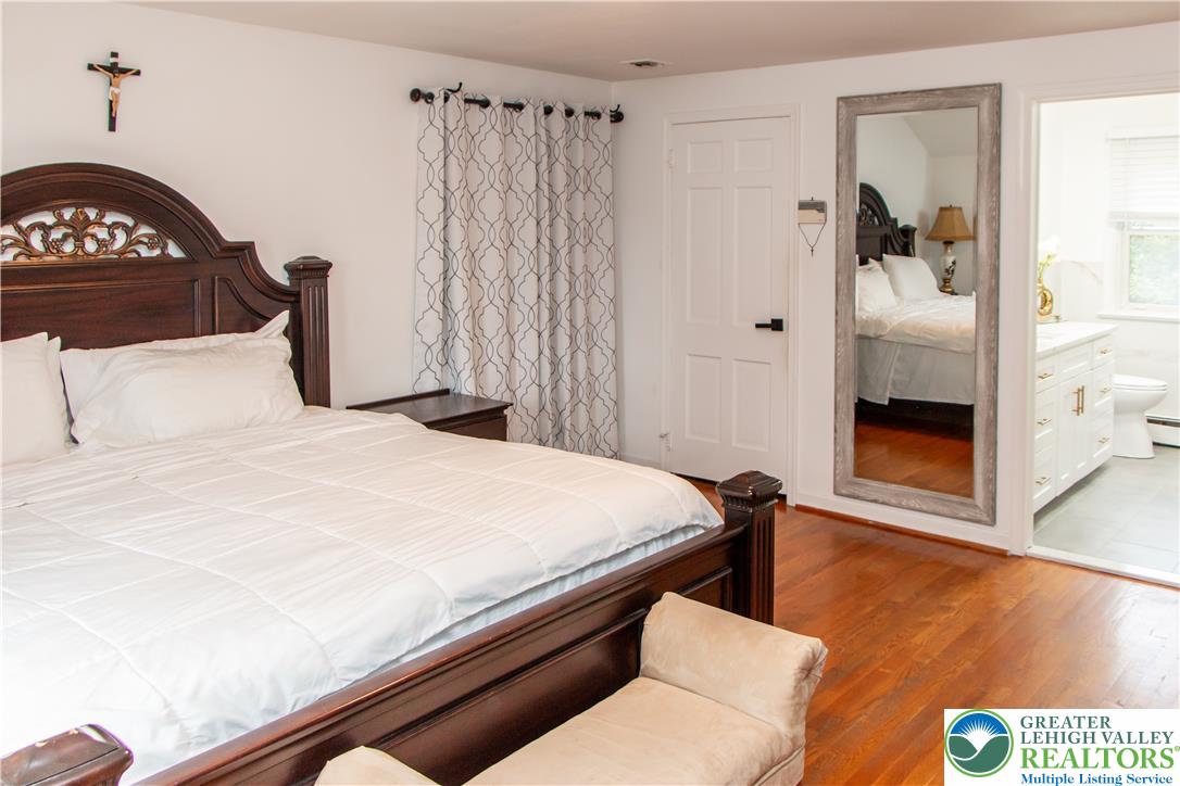 3582 Country Club Road Easton, PA 18045 - Photo 21 of 48 Hardwood floors and a spacious layout enhance this comfortable bedroom with an adjoining private bath.