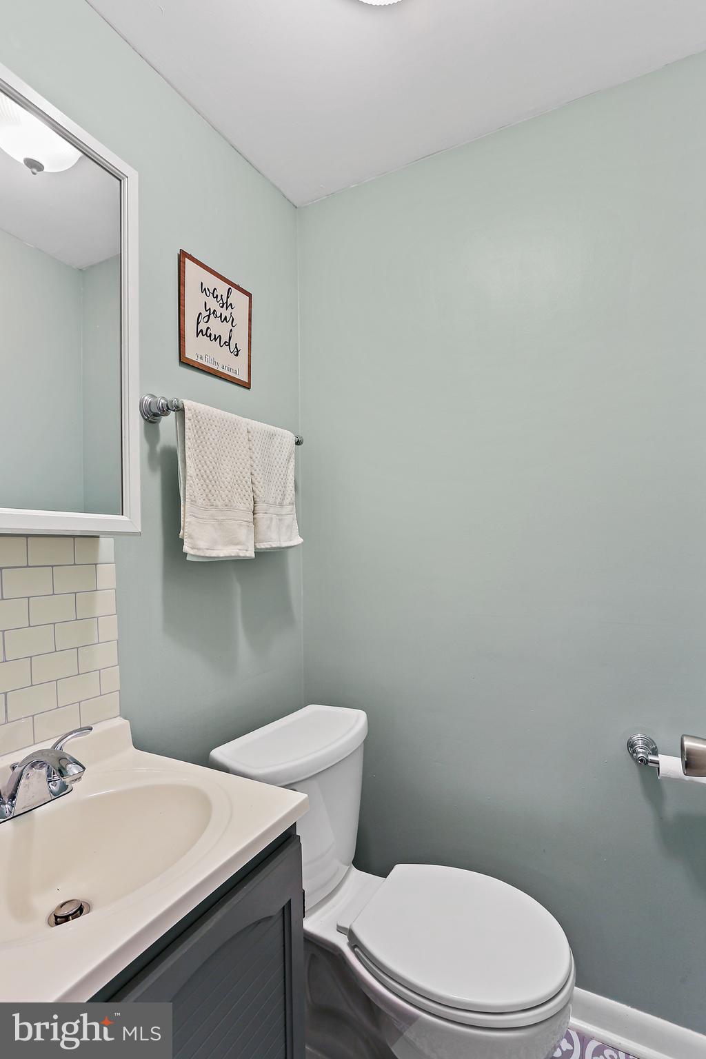 8560 Frederick Road Ellicott City, MD 21043 - Photo 24 of 31 Half Bath with gorgeous flooring