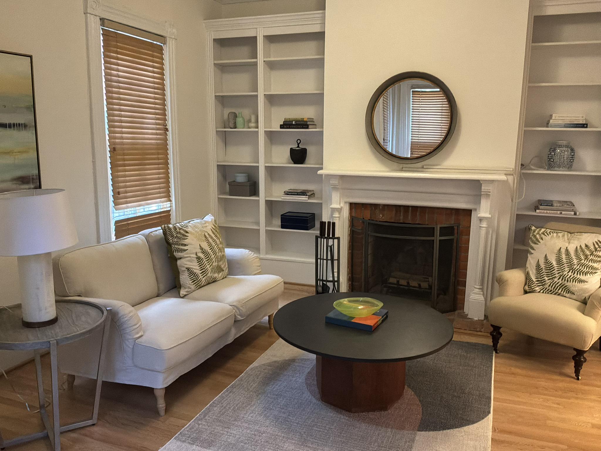 123 7th Street Northeast, Unit 1 Washington, DC 20002 - Photo 2 of 2 Living room with wood-burning fireplace.