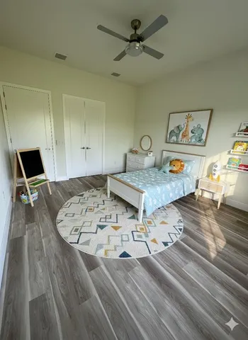 a living room with couch and flat screen tv