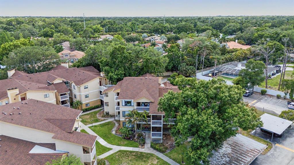 1550 South Belcher Road, Unit 525 Clearwater, FL 33764 - Photo 24 of 28 an aerial view of a house with yard swimming pool and outdoor seating