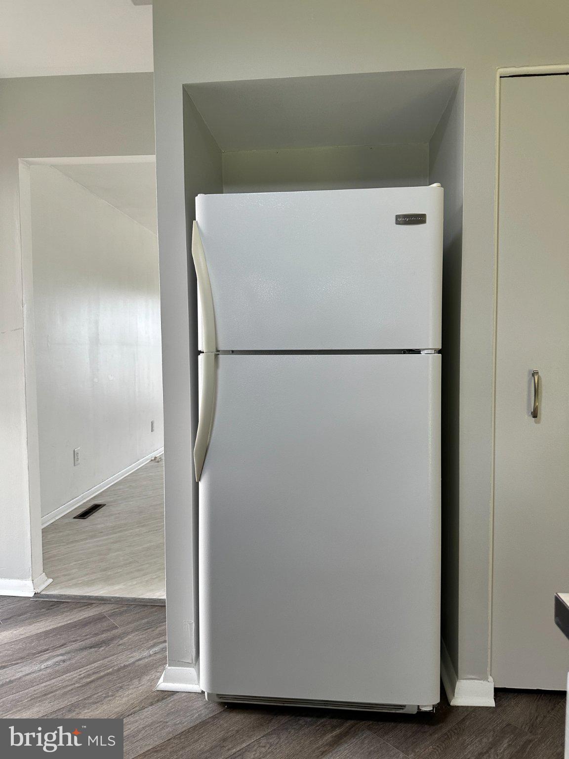 8336 Scotts Level Road Baltimore, MD 21208 - Photo 22 of 55 Sleek fridge nestled in modern space.