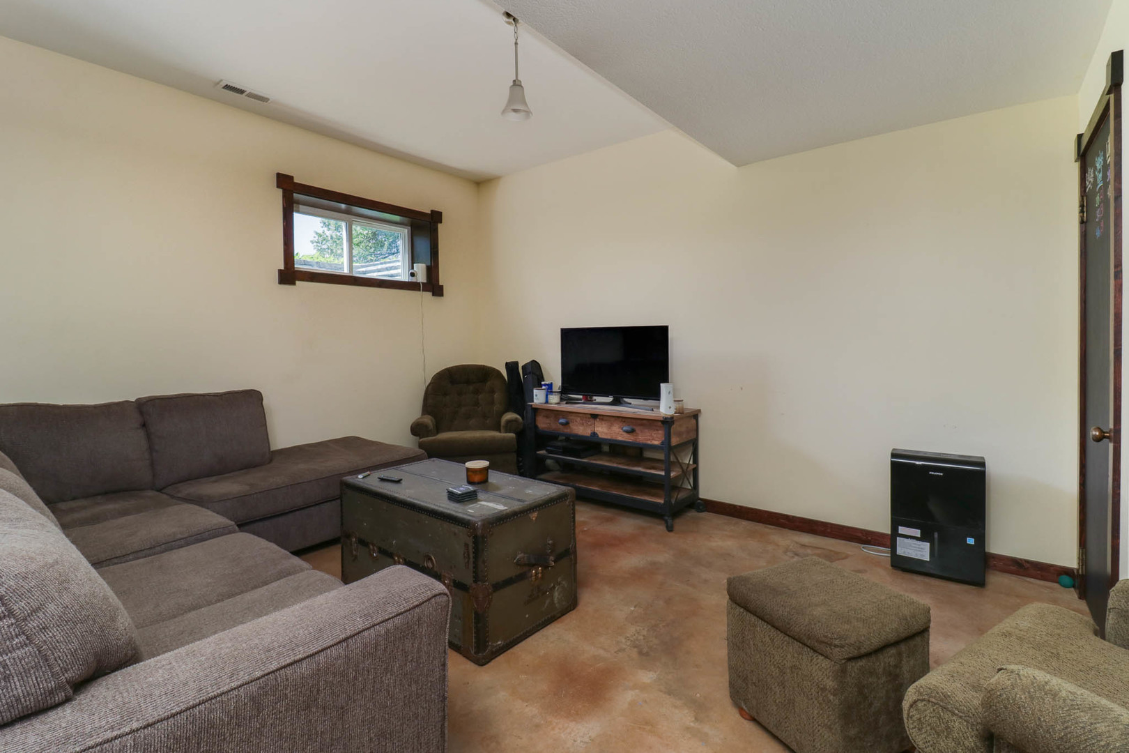 12014 Prairie Center Road Clinton, IL 61727 - Photo 23 of 56 a living room with furniture a couch and a flat screen tv