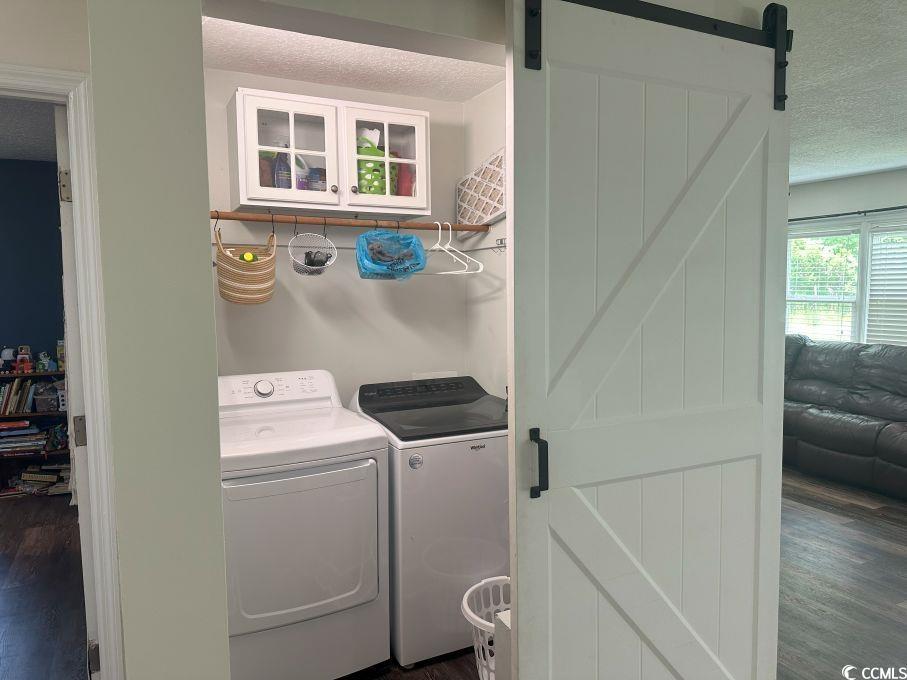 214 Rum Bluff Boulevard Longs, SC 29568 - Photo 11 of 36 Washroom featuring a barn door, washing machine an
