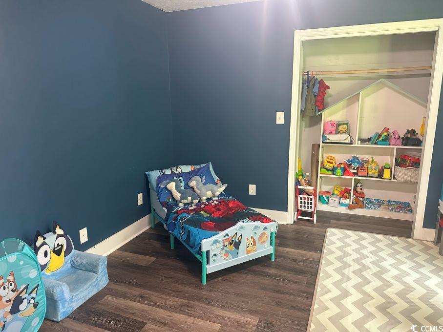 214 Rum Bluff Boulevard Longs, SC 29568 - Photo 15 of 36 Bedroom featuring wood finished floors