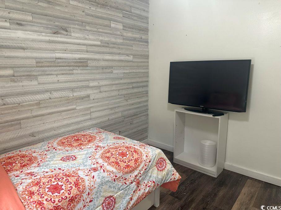 214 Rum Bluff Boulevard Longs, SC 29568 - Photo 20 of 36 Bedroom featuring baseboards and dark wood-type fl
