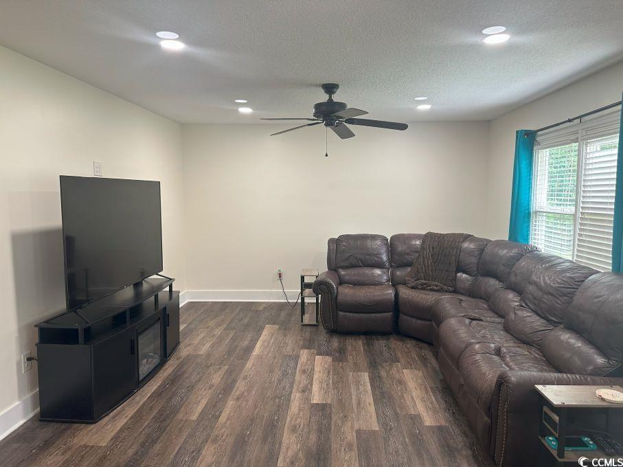 214 Rum Bluff Boulevard Longs, SC 29568 - Photo 2 of 36 Living area with dark wood-style flooring, a ceili