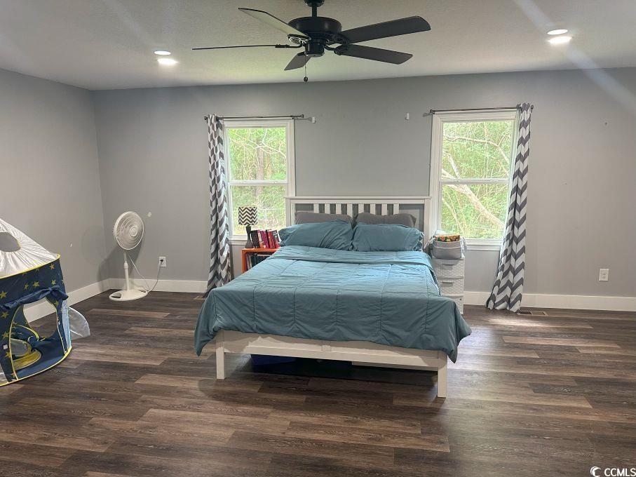 214 Rum Bluff Boulevard Longs, SC 29568 - Photo 21 of 36 Bedroom featuring multiple windows, wood finished