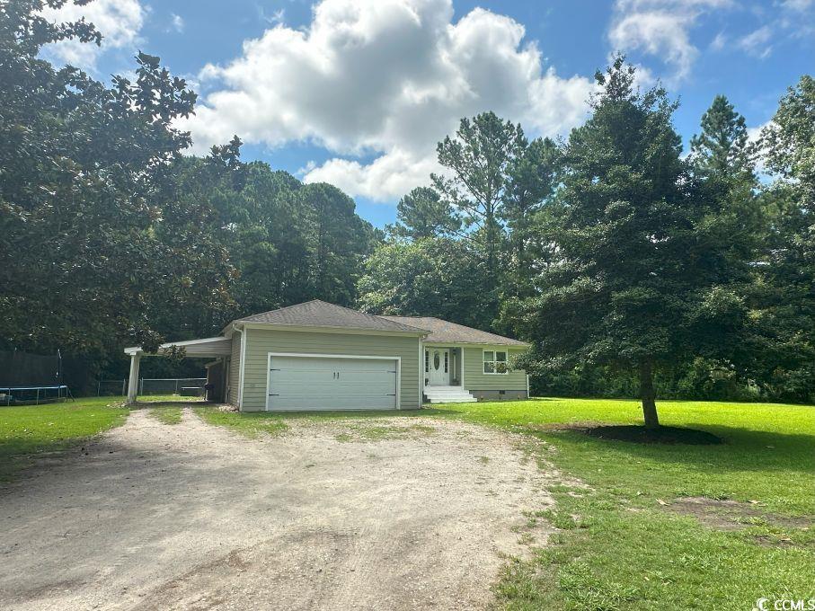 214 Rum Bluff Boulevard Longs, SC 29568 - Photo 30 of 36 View of side of property featuring an attached gar