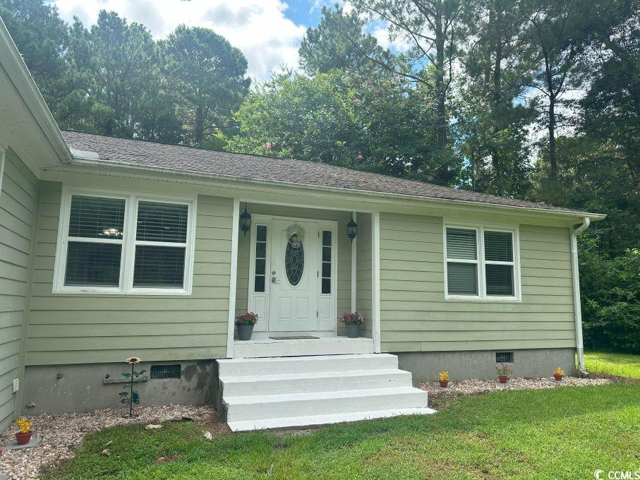 214 Rum Bluff Boulevard Longs, SC 29568 - Photo 34 of 36 Property entrance with crawl space and a yard