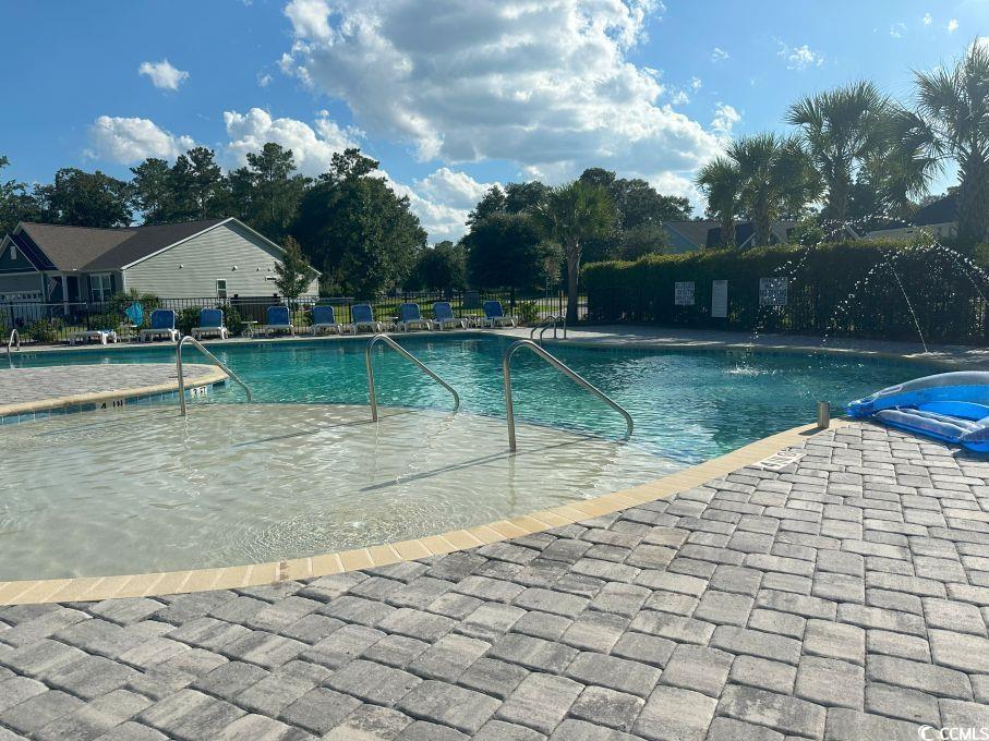 214 Rum Bluff Boulevard Longs, SC 29568 - Photo 36 of 36 Community pool with a patio