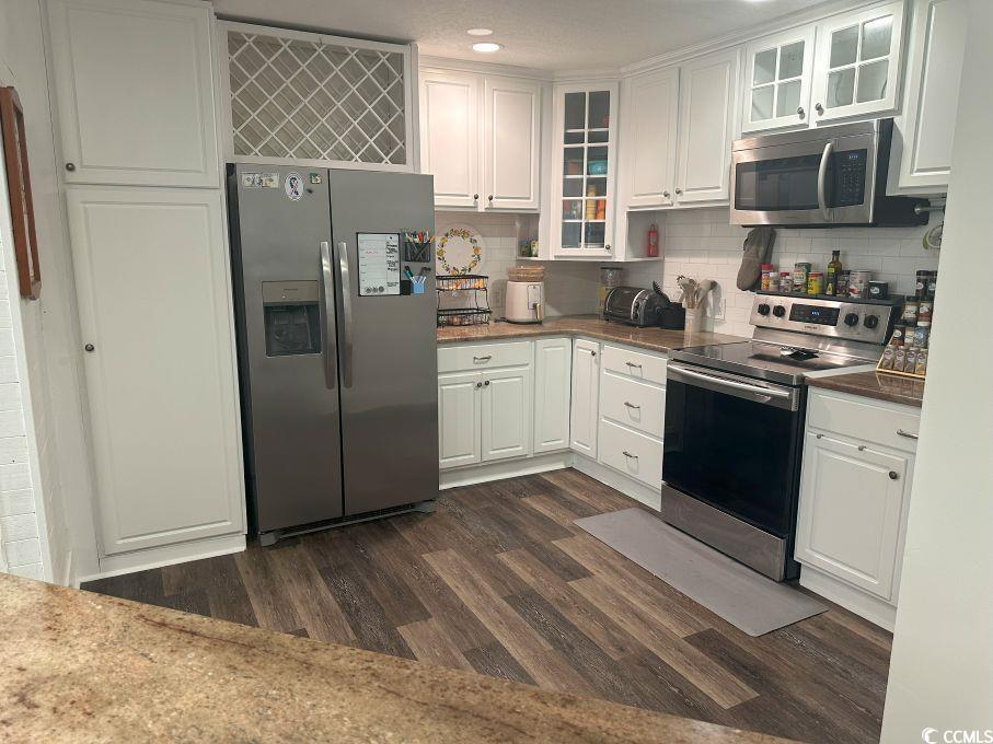 214 Rum Bluff Boulevard Longs, SC 29568 - Photo 6 of 36 Kitchen with stainless steel appliances, dark wood