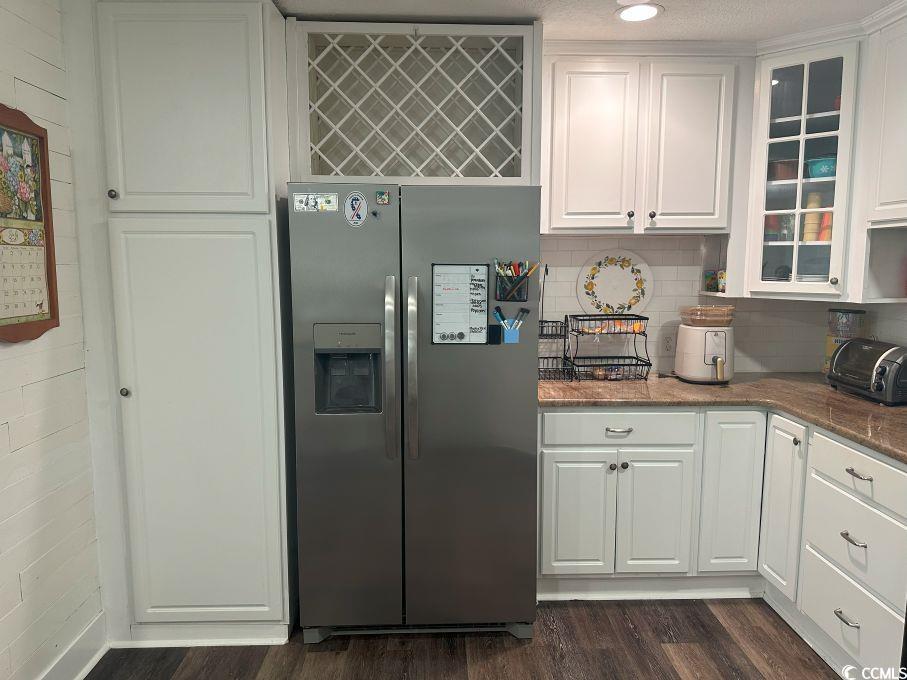 214 Rum Bluff Boulevard Longs, SC 29568 - Photo 7 of 36 Kitchen with stainless steel fridge, dark wood-sty