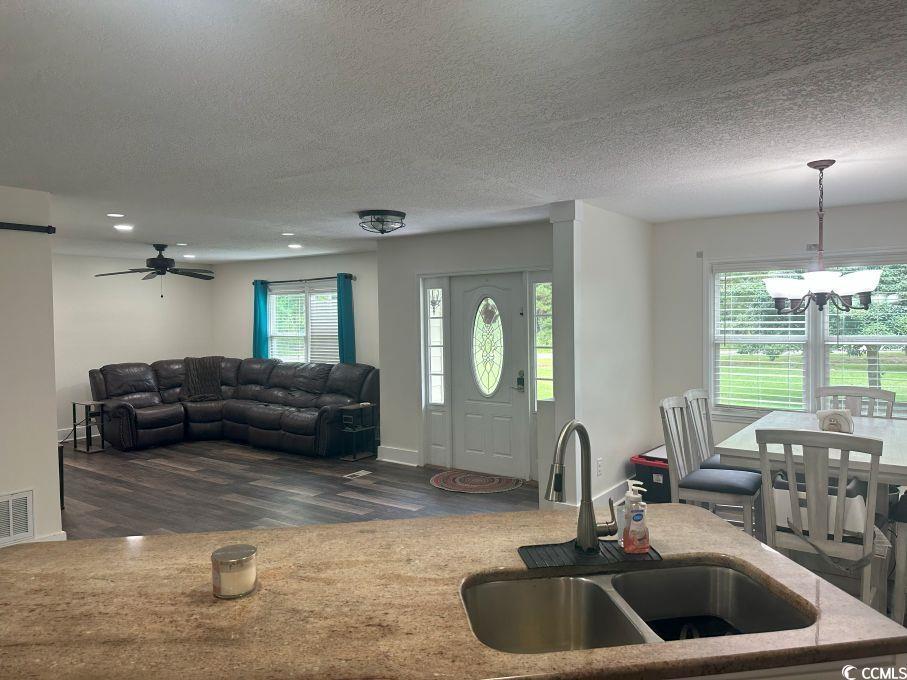 214 Rum Bluff Boulevard Longs, SC 29568 - Photo 8 of 36 Living room with dark wood finished floors, a chan