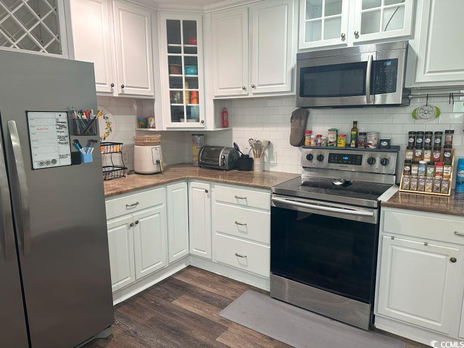 214 Rum Bluff Boulevard Longs, SC 29568 - Photo 10 of 36 Kitchen with stainless steel appliances, white cab