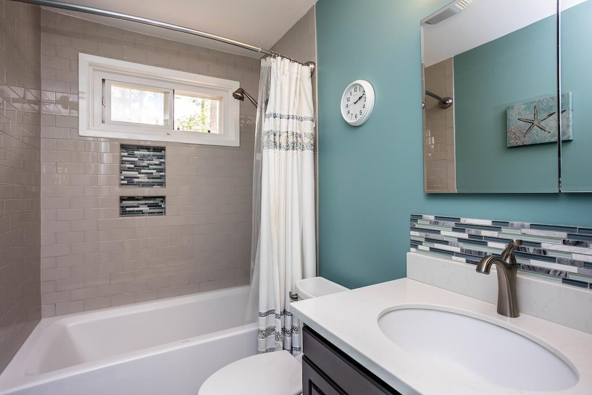 2119 Watkins Street Raleigh, NC 27604 - Photo 13 of 30 Updated bath with ceramic tile