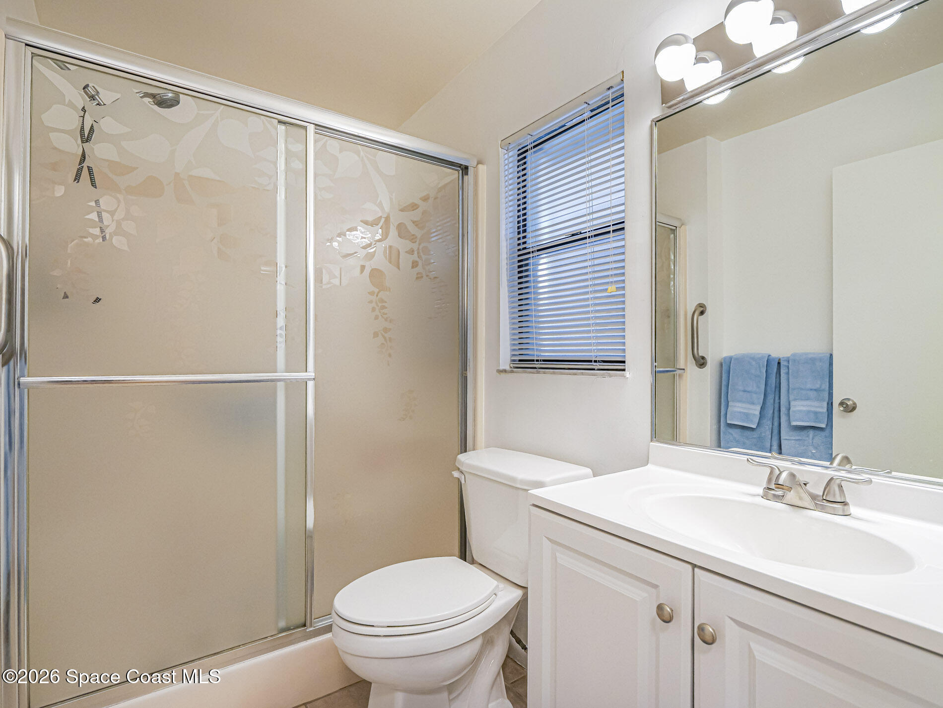 1198 Breezy Way, Unit 7 Sebastian, FL 32958 - Photo 13 of 34 a bathroom with a sink a toilet and shower