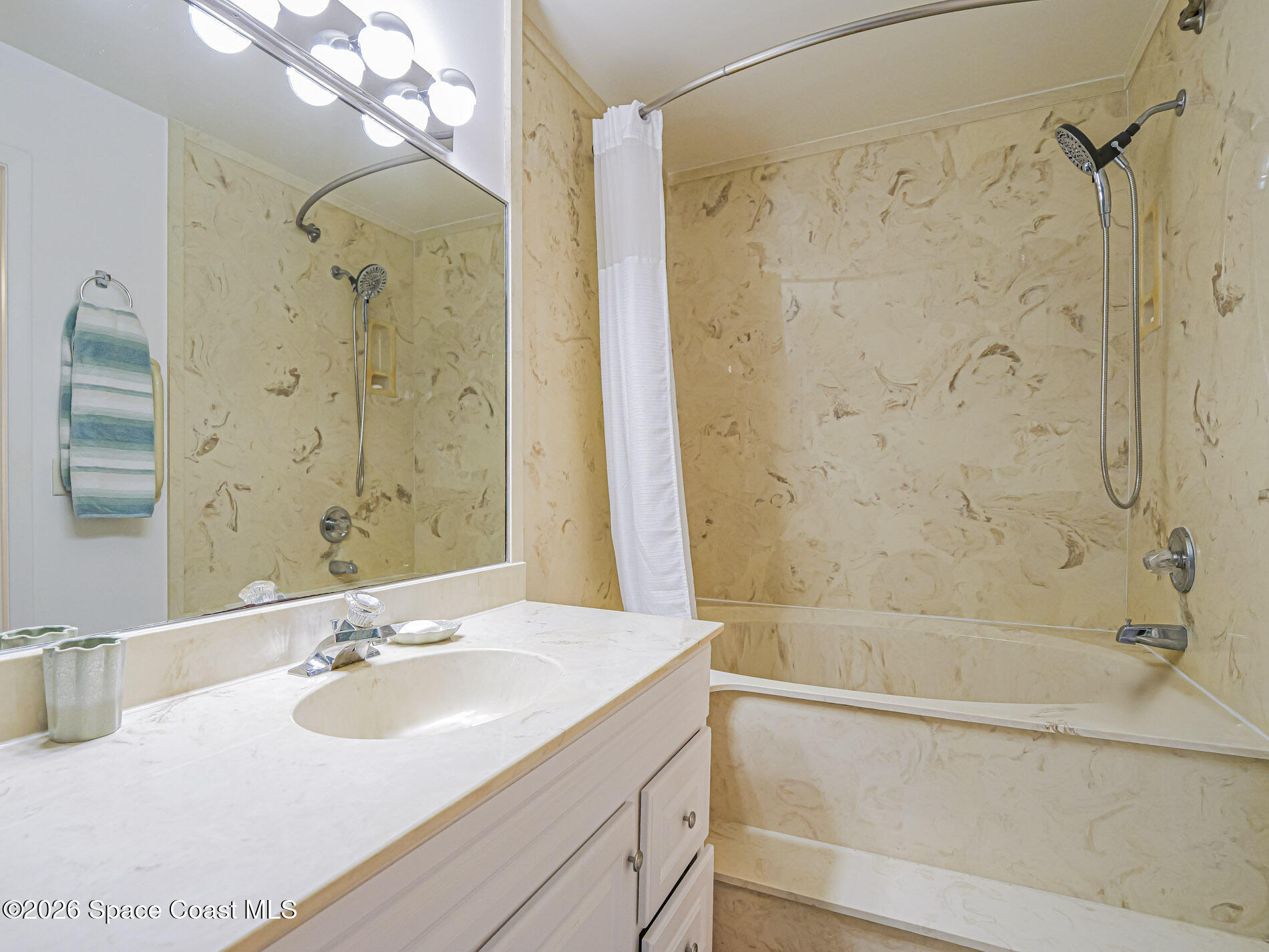 1198 Breezy Way, Unit 7 Sebastian, FL 32958 - Photo 16 of 34 a bathroom with a sink shower and a mirror