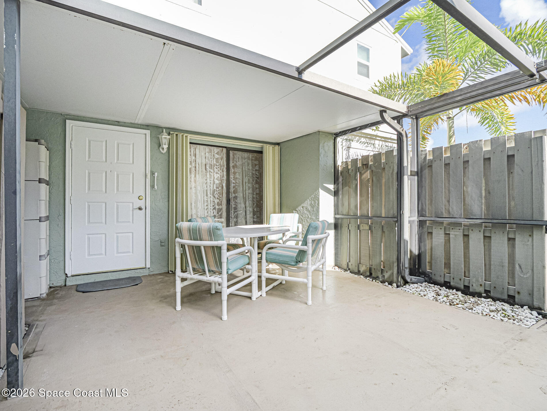 1198 Breezy Way, Unit 7 Sebastian, FL 32958 - Photo 19 of 34 a dining room with furniture and a window
