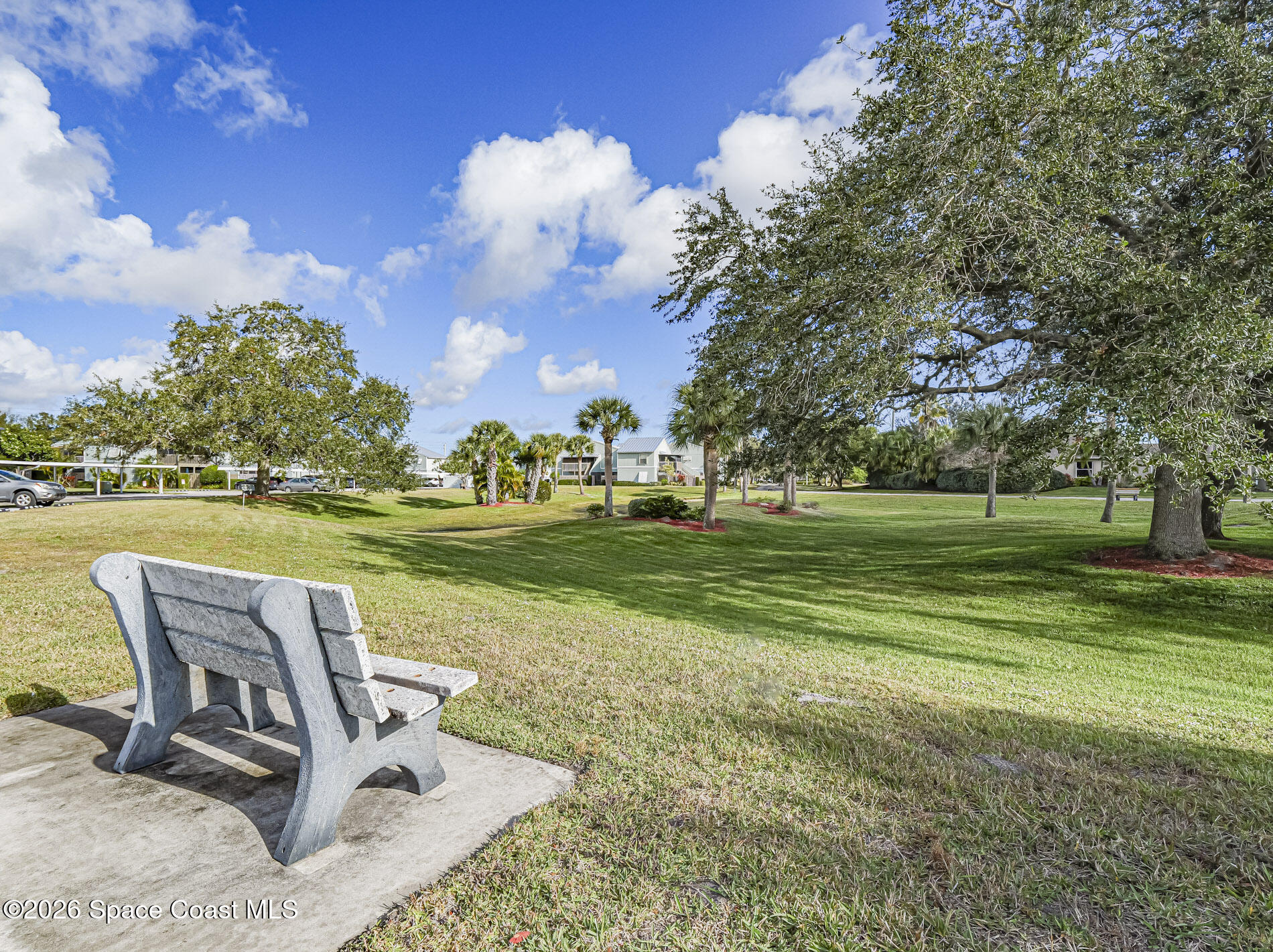 1198 Breezy Way, Unit 7 Sebastian, FL 32958 - Photo 23 of 34 a view of a park with large trees