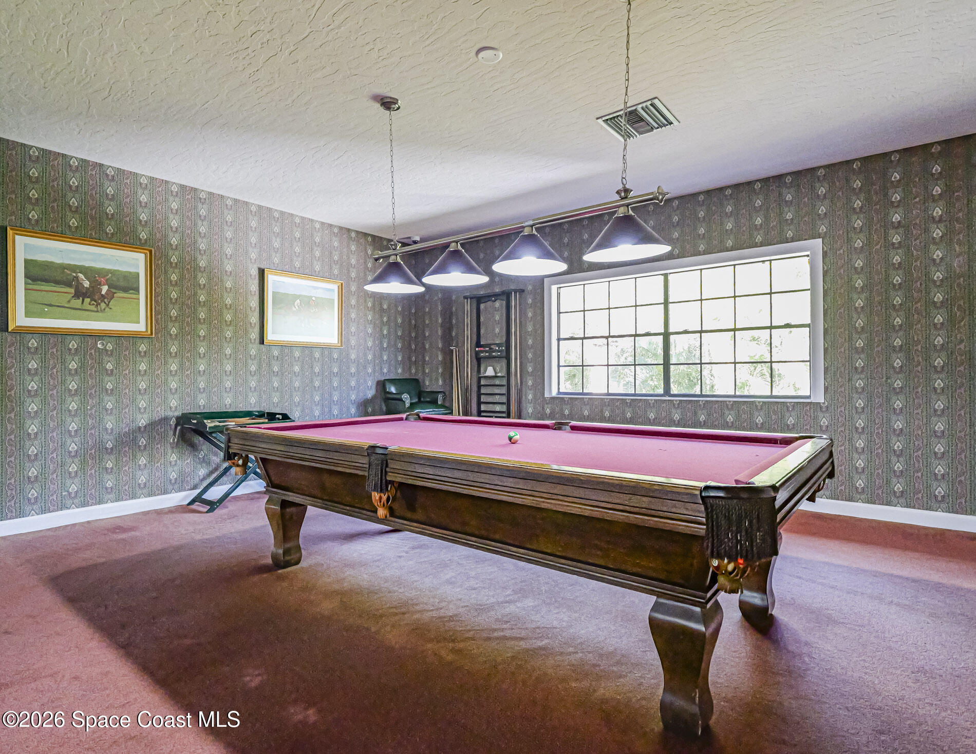 1198 Breezy Way, Unit 7 Sebastian, FL 32958 - Photo 27 of 34 a room with pool table and windows