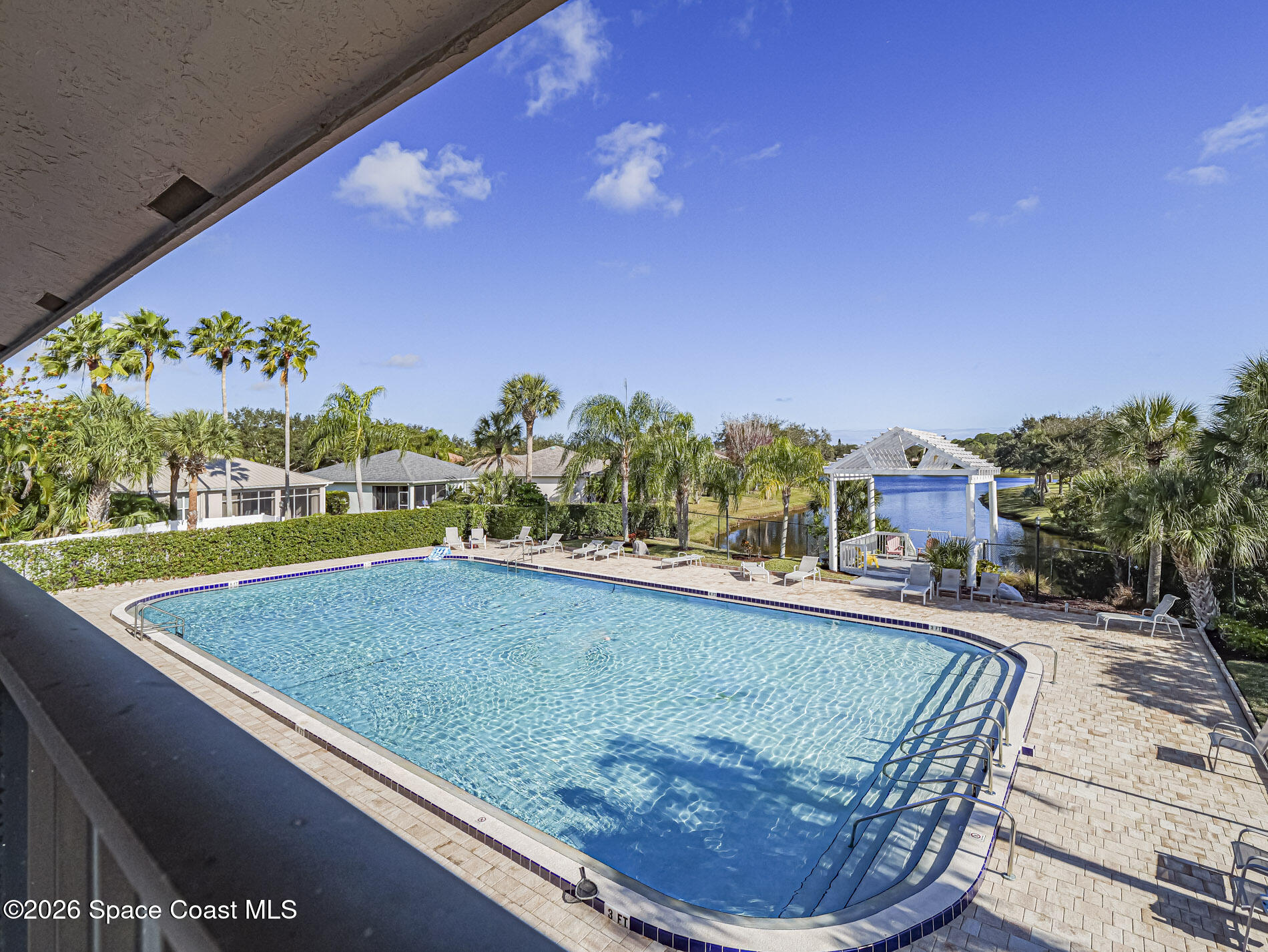 1198 Breezy Way, Unit 7 Sebastian, FL 32958 - Photo 29 of 34 a view of swimming pool from a balcony