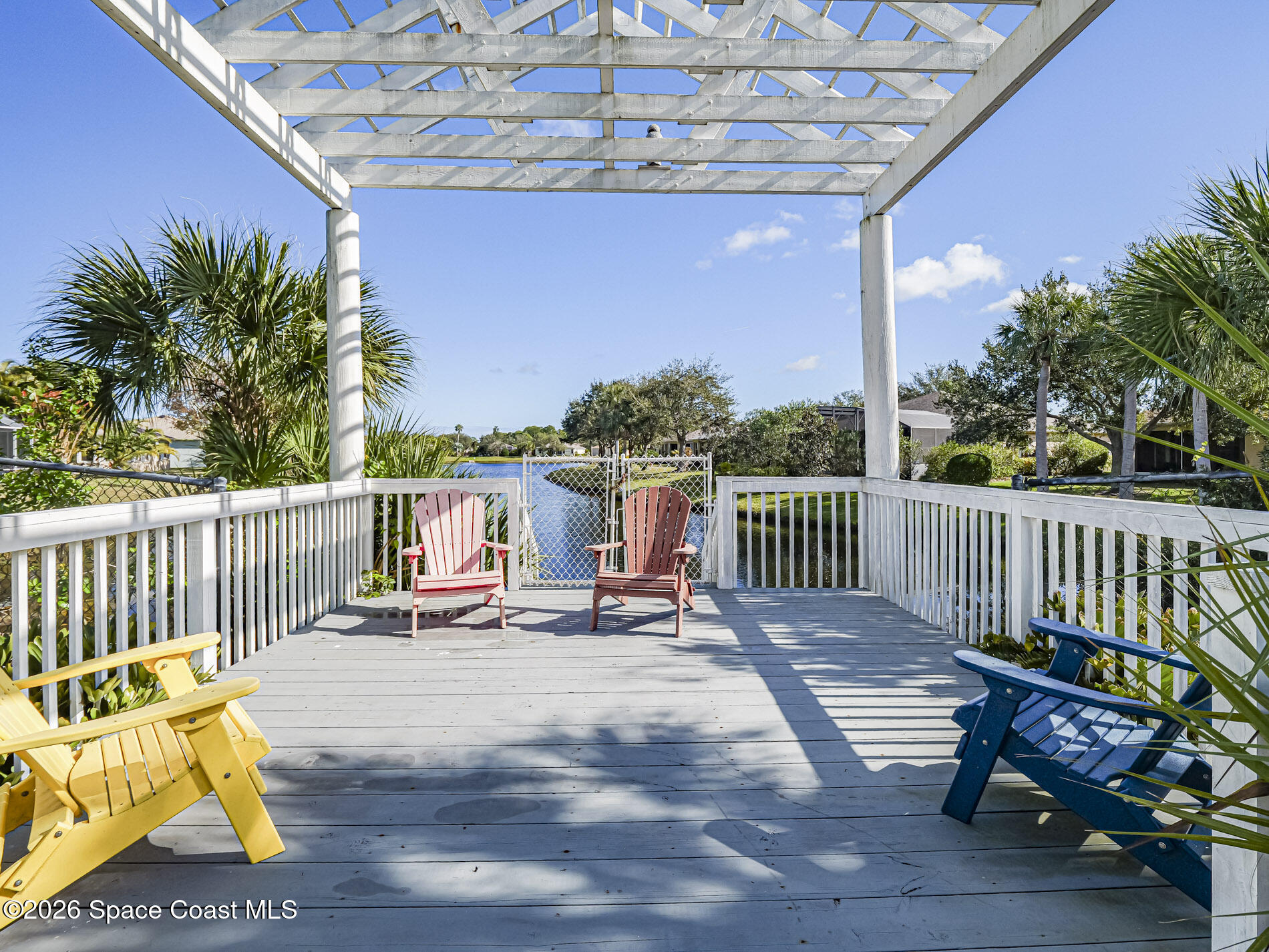 1198 Breezy Way, Unit 7 Sebastian, FL 32958 - Photo 32 of 34 a view of a chair and tables on the roof deck