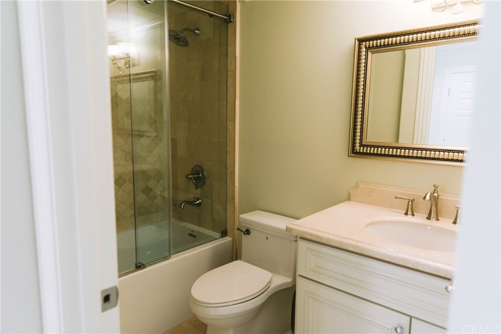 1122 Drake Road Arcadia, CA 91007 - Photo 16 of 30 a bathroom with a granite countertop toilet a sink and a bathtub