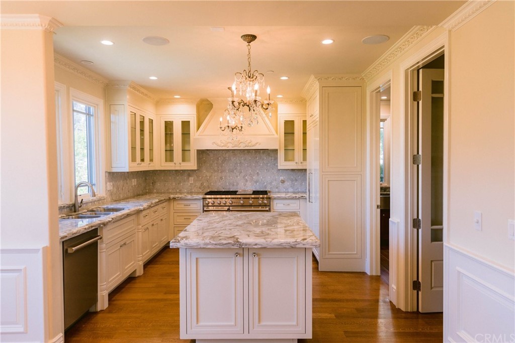 1122 Drake Road Arcadia, CA 91007 - Photo 5 of 30 a kitchen with a sink stove and cabinets