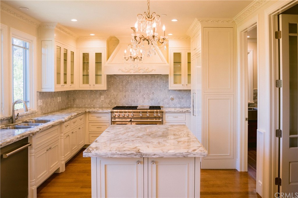 1122 Drake Road Arcadia, CA 91007 - Photo 6 of 30 a kitchen with a sink and cabinets