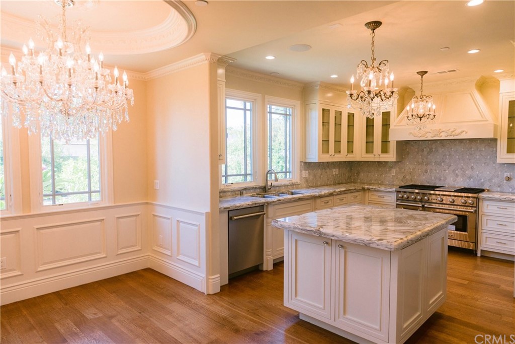 1122 Drake Road Arcadia, CA 91007 - Photo 8 of 30 a kitchen that has a lot of cabinets in it
