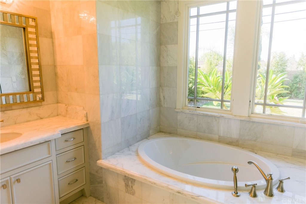 1122 Drake Road Arcadia, CA 91007 - Photo 10 of 30 a bathroom with a tub a sink and a window
