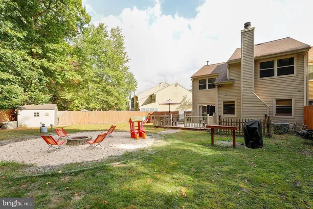 an outdoor space with furniture and garden