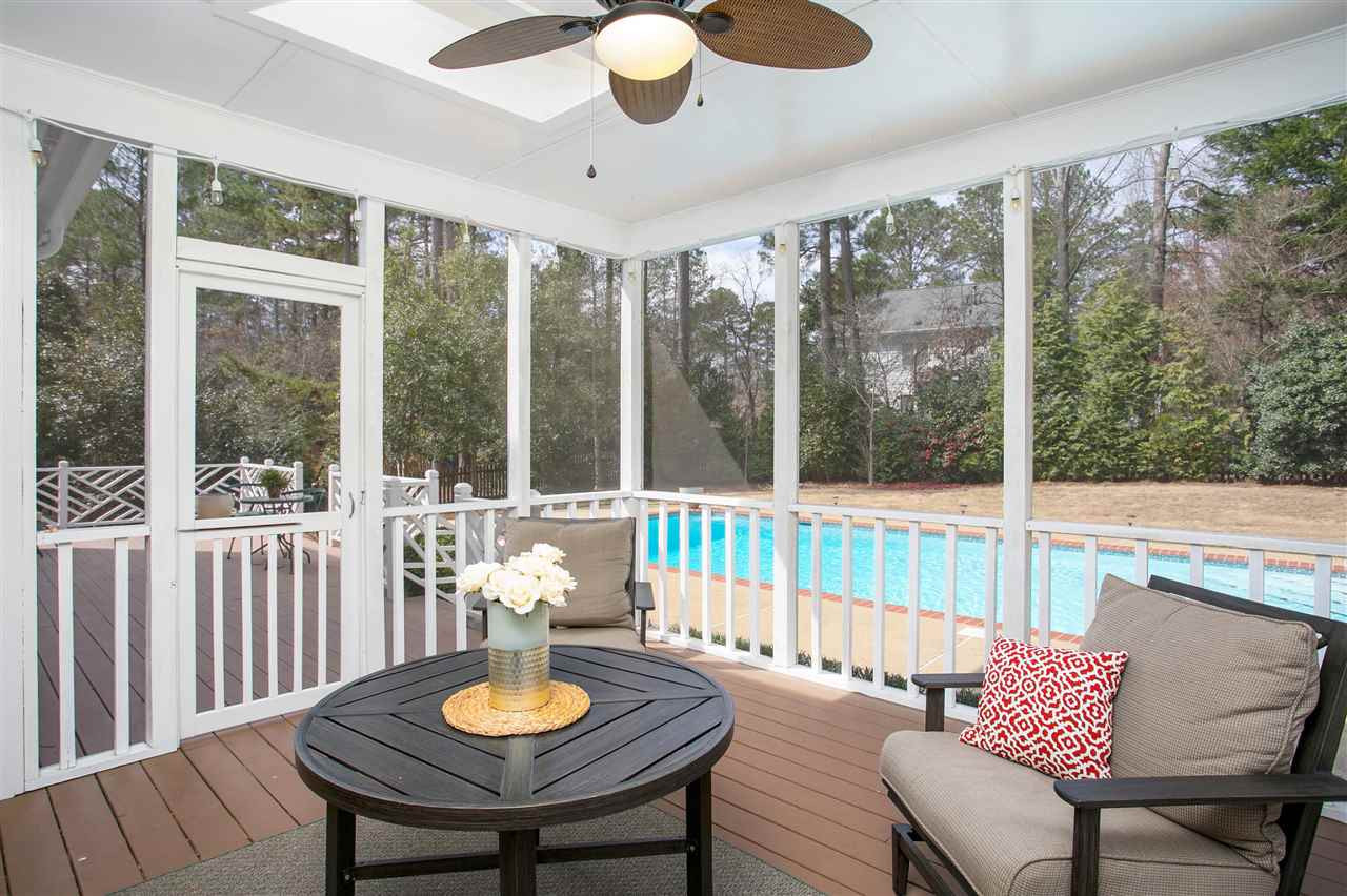 7102 Spring Ridge Road Cary, NC 27518 - Photo 24 of 25 WE CAN'T THINK OF A MORE PERFECT SETTING THAN WHAT YOU SEE RIGHT HERE...SITTING IN YOUR FABULOUS SCREENED PORCH SIPPING ON "SOMETHING" WHILE VIEWING FRIENDS PLAYING IN THE POOL OR KIDS KICKING A BALL IN THE YARD! SCREENED PORCH