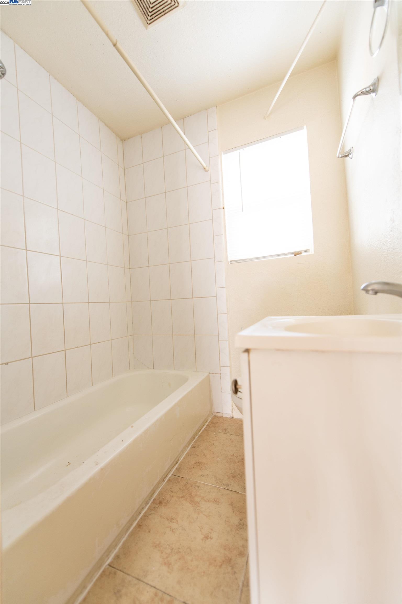 731 Calvados Avenue, Unit B Sacramento, CA 95815 - Photo 6 of 7 a bathroom with a bathtub and a shower