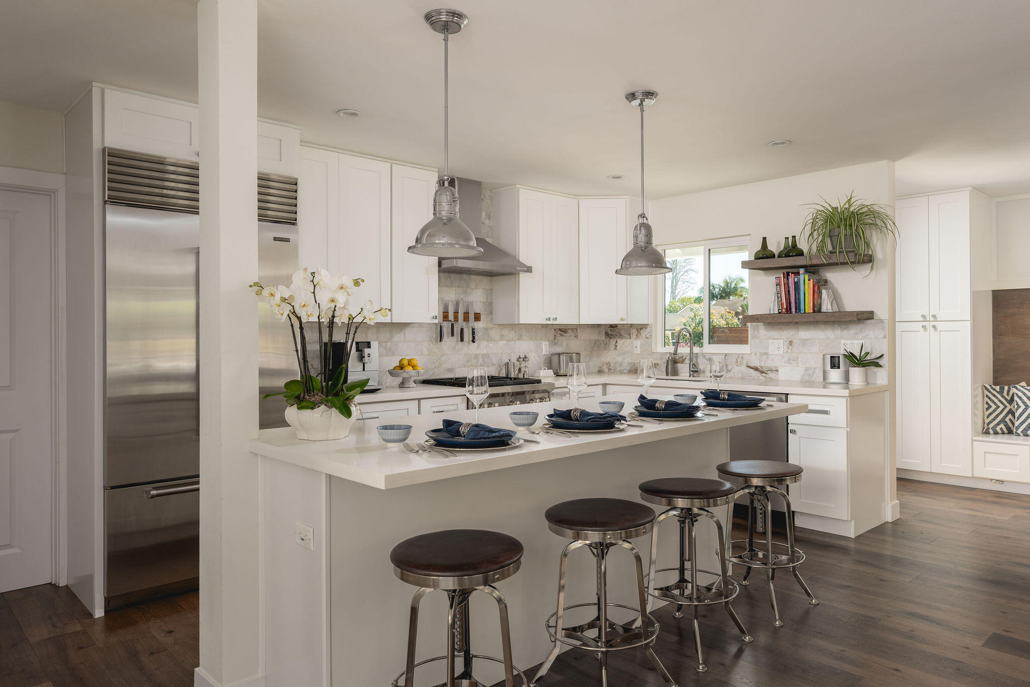 571 Windsor Avenue Goleta, CA 93117 - Photo 18 of 43 a kitchen with kitchen island white cabinets and stainless steel appliances