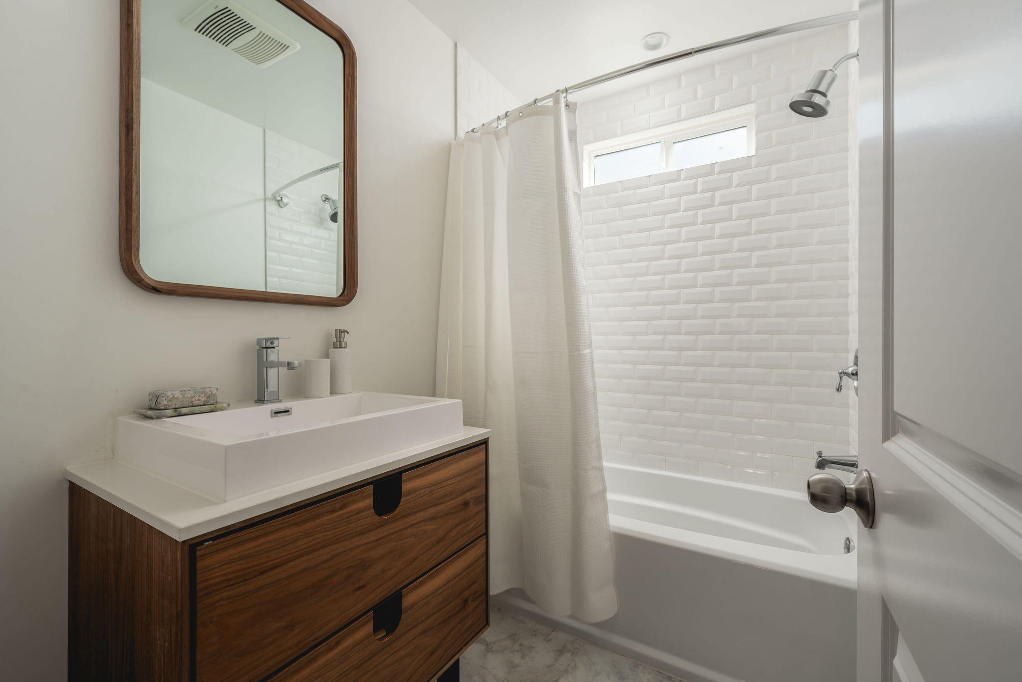 571 Windsor Avenue Goleta, CA 93117 - Photo 26 of 43 a bathroom with a sink a mirror and a shower