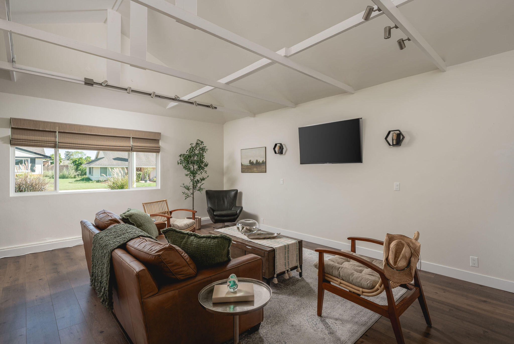 571 Windsor Avenue Goleta, CA 93117 - Photo 27 of 43 a living room with furniture and a flat screen tv