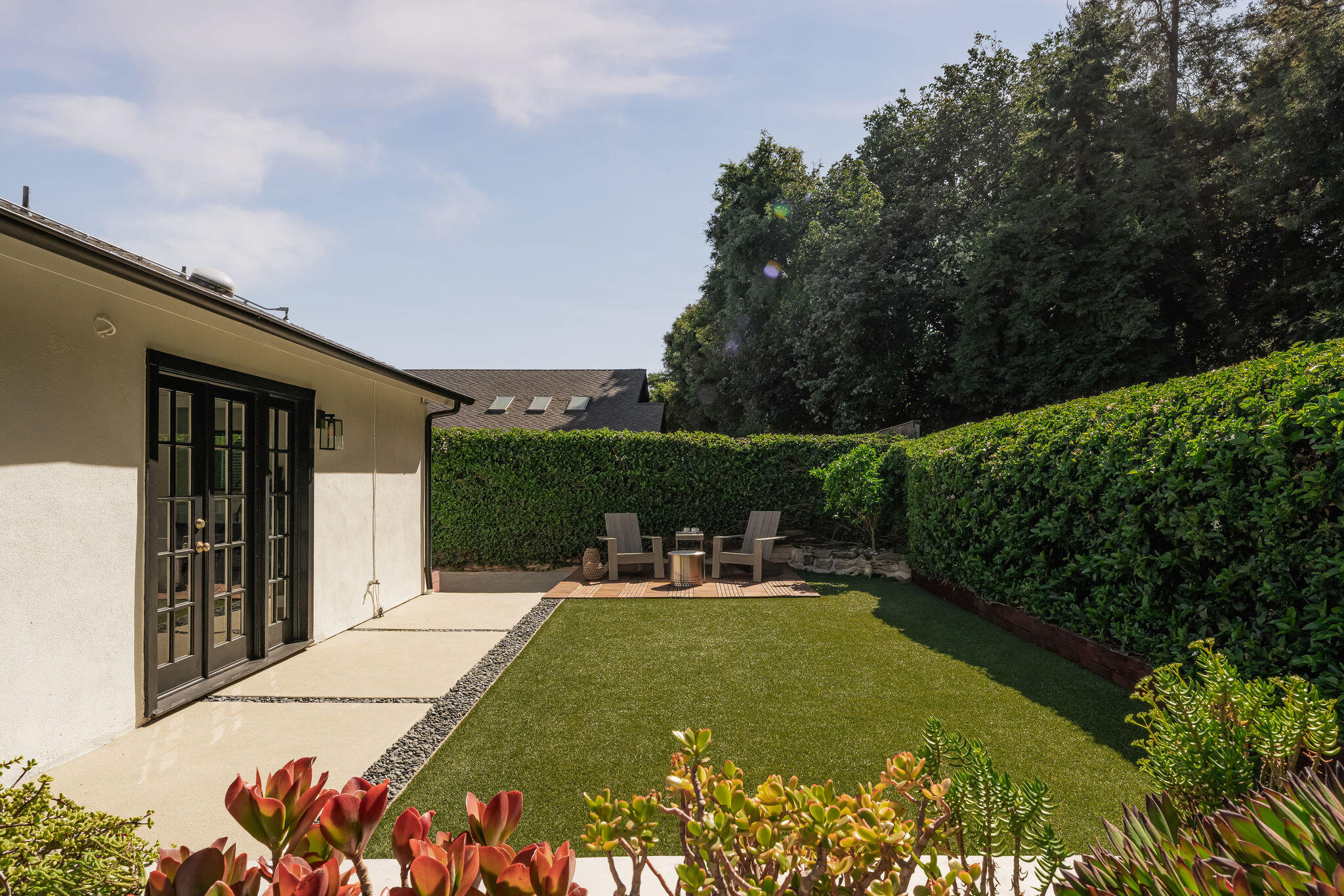 571 Windsor Avenue Goleta, CA 93117 - Photo 32 of 43 a view of a patio with table and chairs potted plants with floor to ceiling window