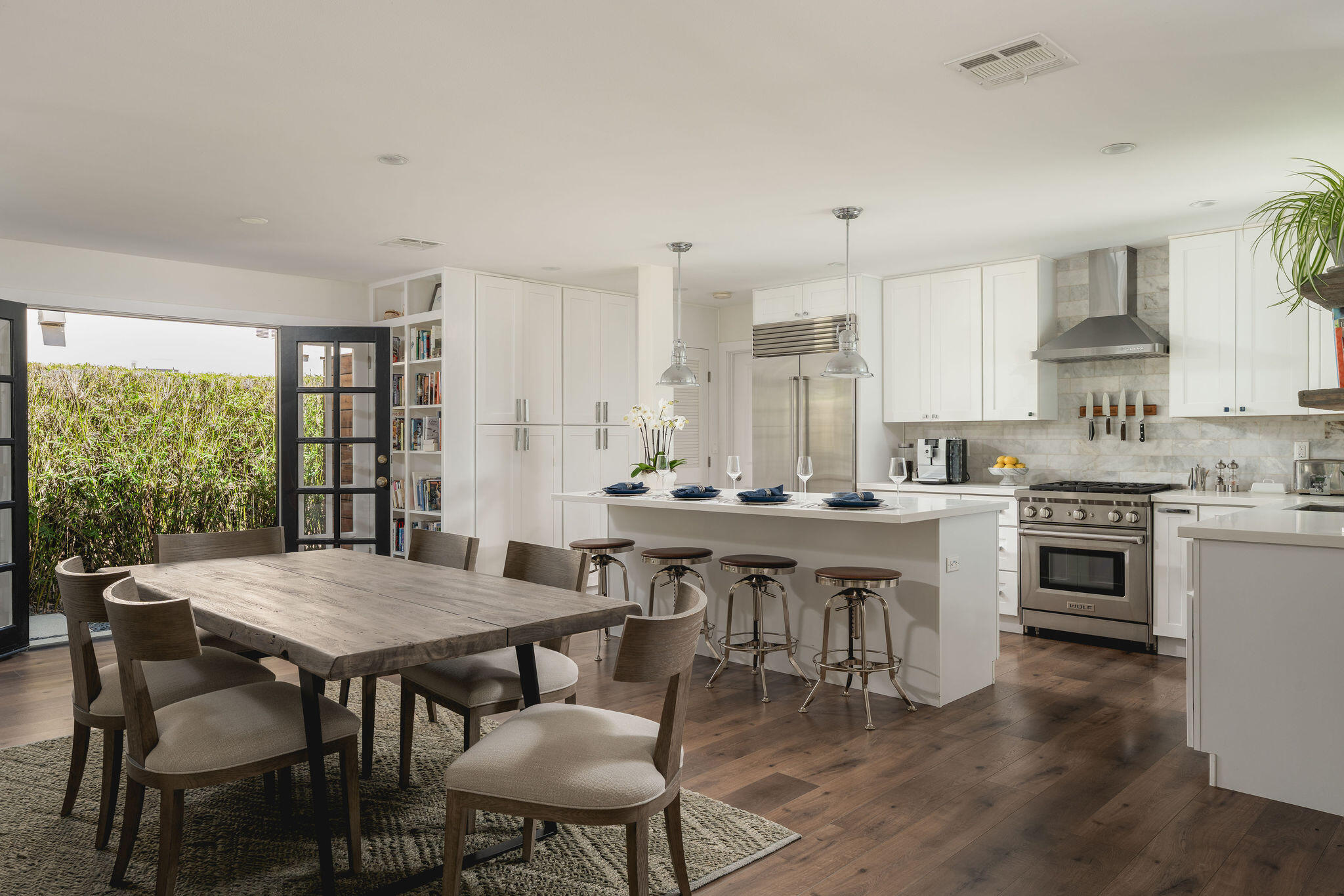 571 Windsor Avenue Goleta, CA 93117 - Photo 8 of 43 a kitchen with a dining table chairs and stove